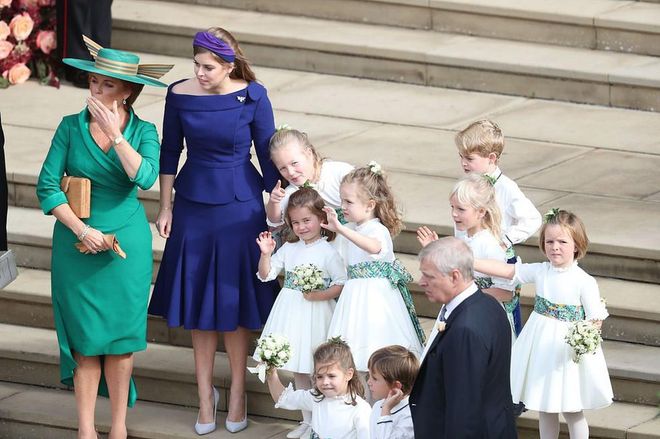 Sarah Ferguson, Princess Beatrice and all of the pageboys and bridesmaids stand on the steps of St. George's Chapel.