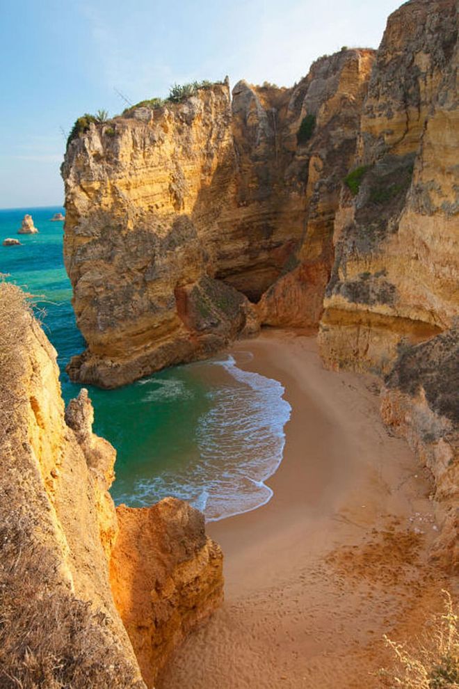 Surrounded by cliffs, this small beach outside of Lagos is one of the most beautiful in Portugal's Algarve region.