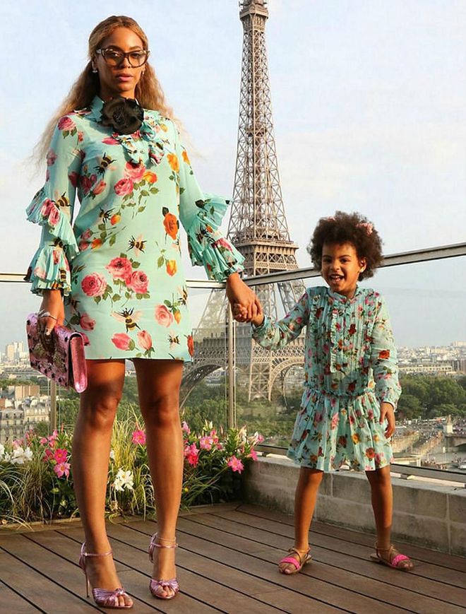 Once again winning mommy-and-me style, Beyoncé and Blue Ivy wore matching floral Gucci dresses while vacationing in Paris. Although they both accessorized with pink sandals (Bey's were metallic heels), Blue added pink cat ears for a playful spin to the look. Beyoncé, on the other hand, wore cat-eye glasses and a black flower around her collar. Photo: Beyonce.com