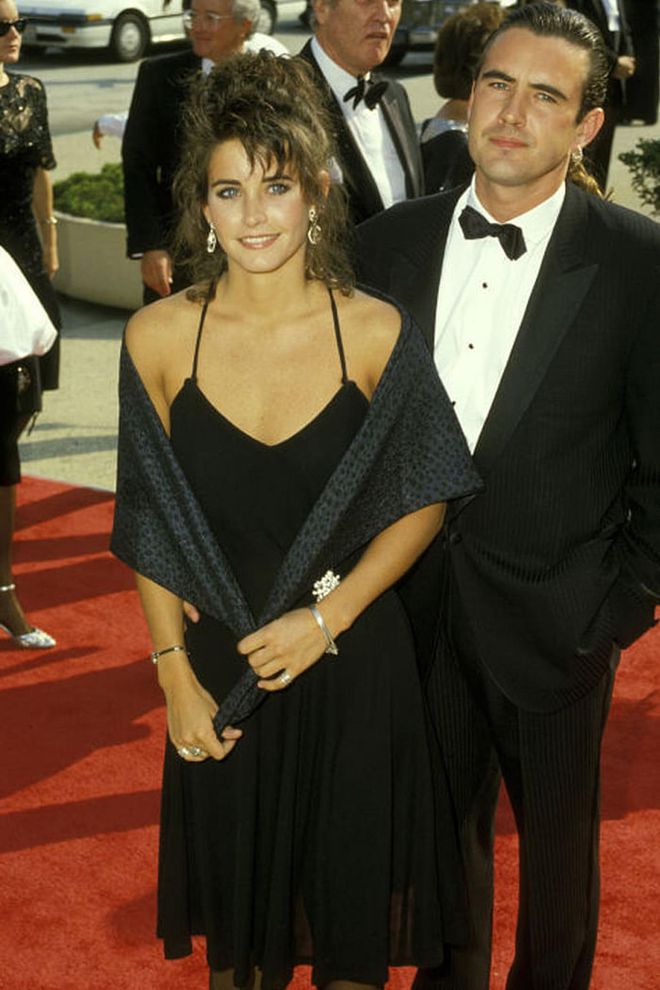 Cox walked the Emmy red carpet with her then-boyfriend Paul Brown (and a shawl) in 1987. 