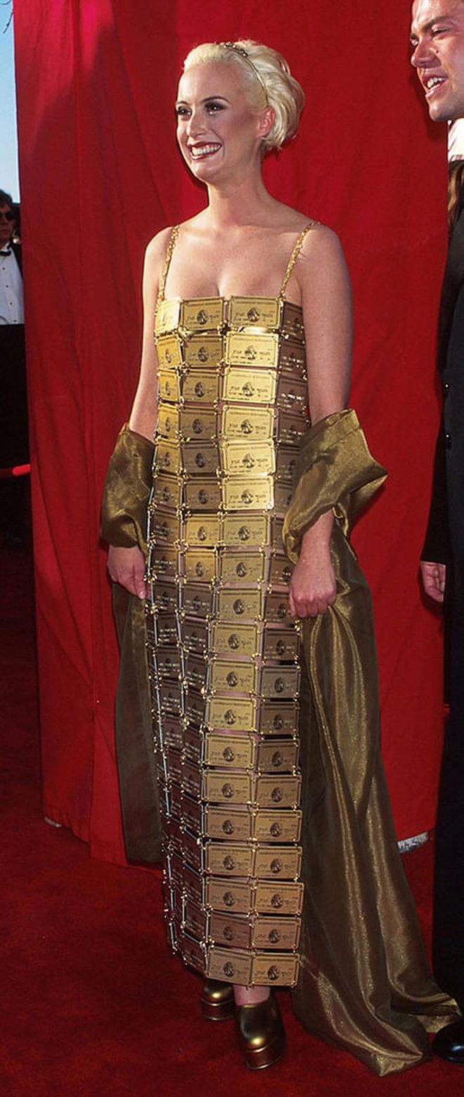 Fact: Lizzie Gardiner won an Oscar in 1995 for Best Costume Design. Fact: Gardiner also designed this dress made of 254 expired American Express Gold cards. She originally created the dress for the film Priscilla, Queen of the Desert but ultimately couldn't use it in the movie because American Express didn't approve. After Gardiner wore the dress to the Oscars though, AmEx bought the dress.