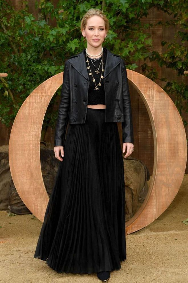 Jennifer Lawerence was seen at the Dior show in a pleated skirt and leather jacket.

Photo: Getty