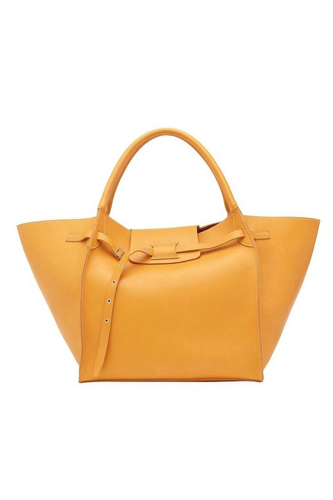 Celine's bags are often seen on the arms of editors and influencers and this season is no different. Opt for its oversized calfskin styles in a citrus shade to brighten gloomy winter days. Those not in favour of colourful accessories will be tempted by its dark brown version.