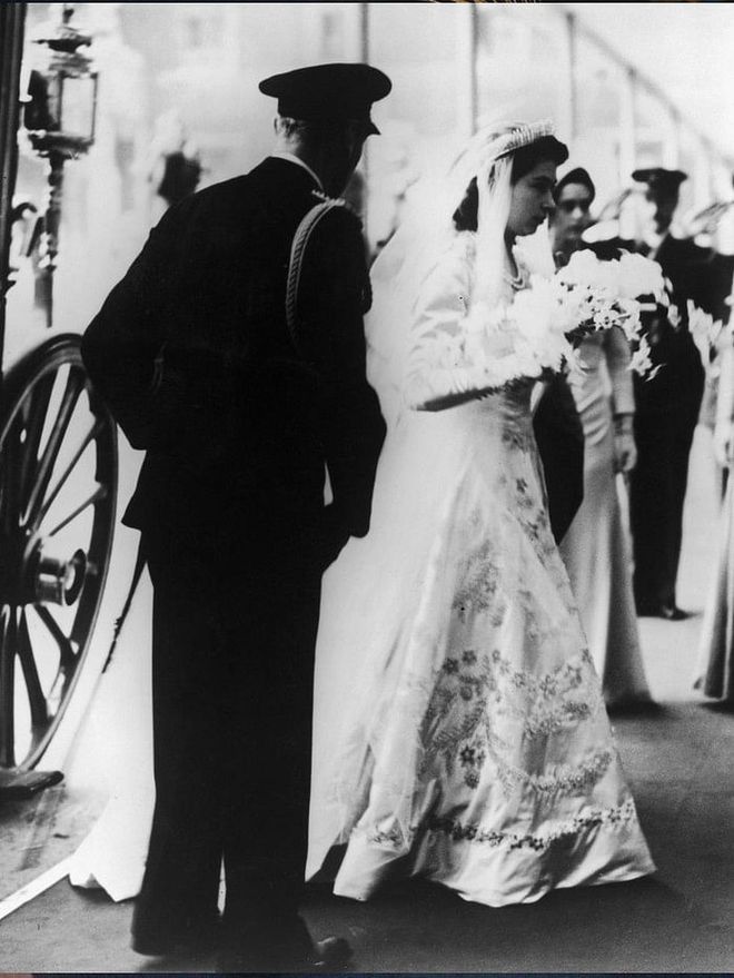 Before she took the throne herself, Princess Elizabeth was escorted by her father, King George VI, during her wedding to Lieutenant Philip Mountbatten in 1942.

Photo: Getty
