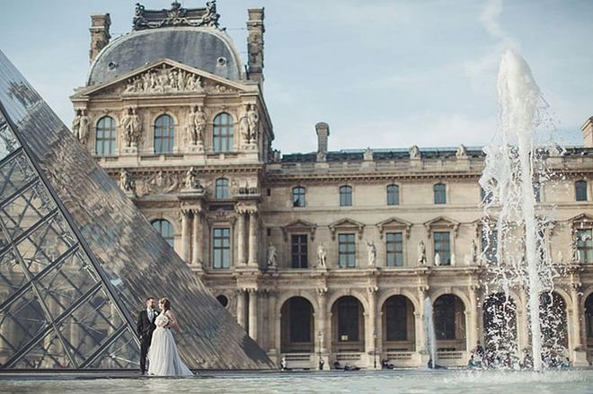 The stunning backdrop of the Louvre can't even outshine the love of this couple. Just before, the pair had tied the knot from a private river bank near the Eiffel Tower.

