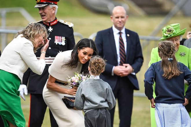 And receive a welcoming bouquet from local children. Photo: Getty