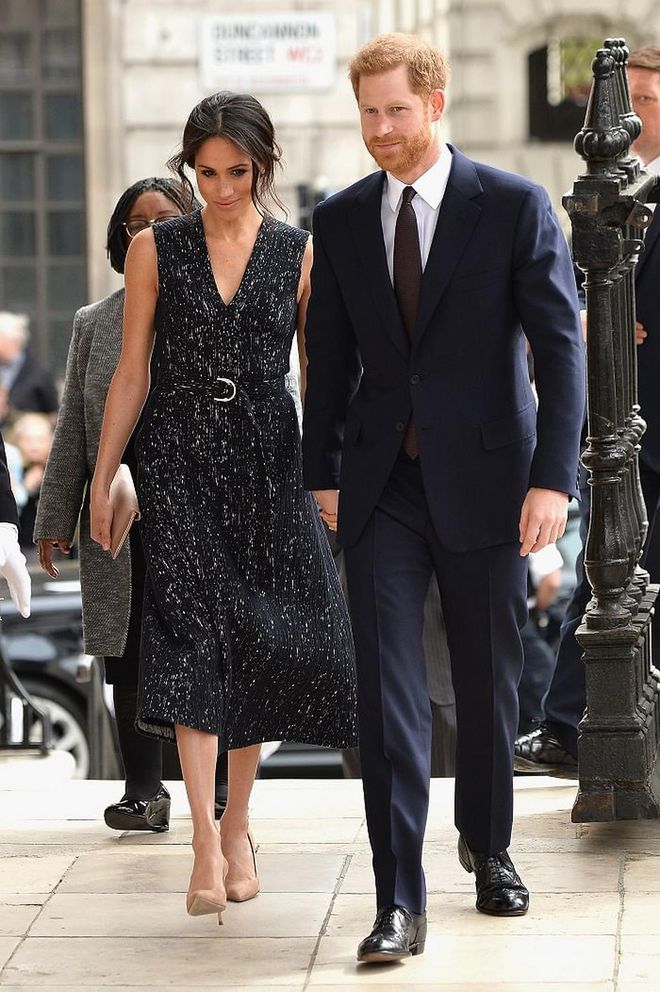Meghan attended a memorial service in a gorgeous black speckled Hugo Boss dress from their SS18 Ready-To-Wear collection and  her classic nude Manolo pumps. She matched it with a nude bespoke clutch from Wilbur & Gussie. 