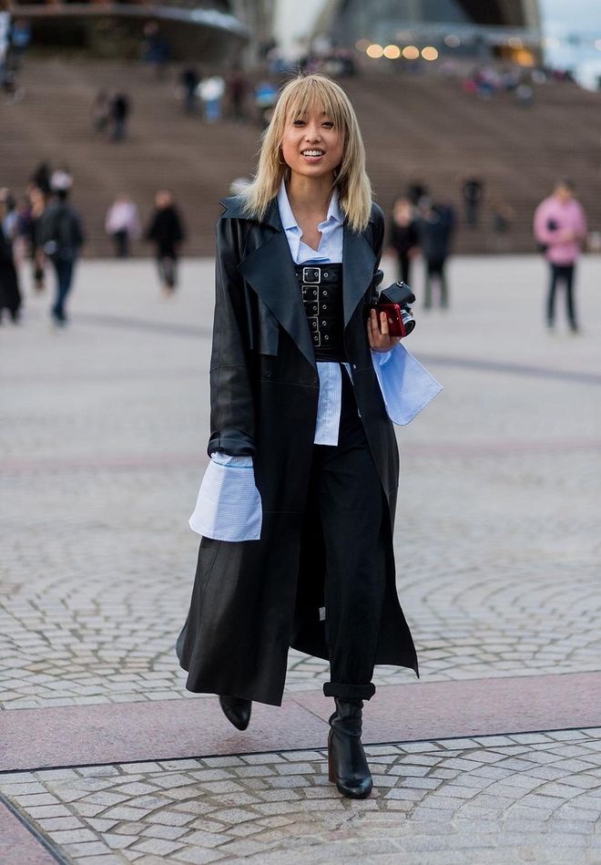 Margaret Zhang wearing a corset, button shirt with wide sleeves, leather coat. Photo: Getty 