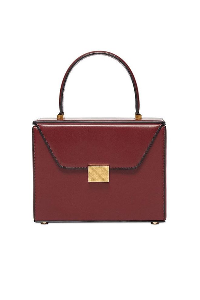 Nothings says ladylike chic more than Victoria Beckham's box bag, inspired by elegant vanity cases.
