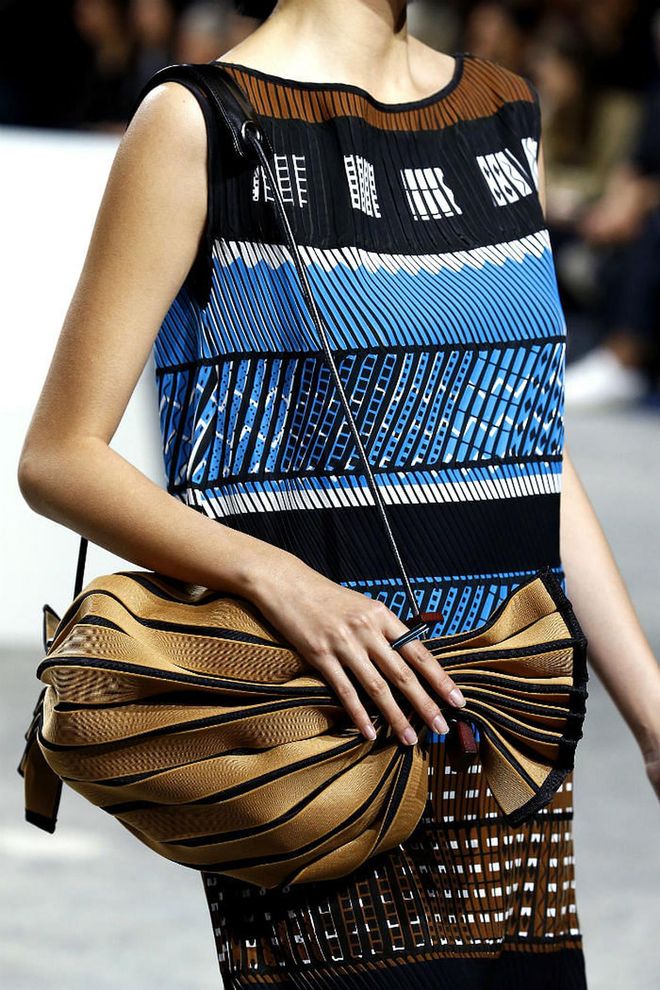 Seen at: Paris Fashion Week//Why we love it:  Leather panels are pieced into this handy drawstring bag, elevating a casual piece into practical-luxe levels. (Photo: Getty)
