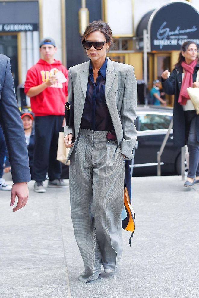 Victoria Beckham looks polished but modern in her wide-leg trouser suit. Photo: Getty 