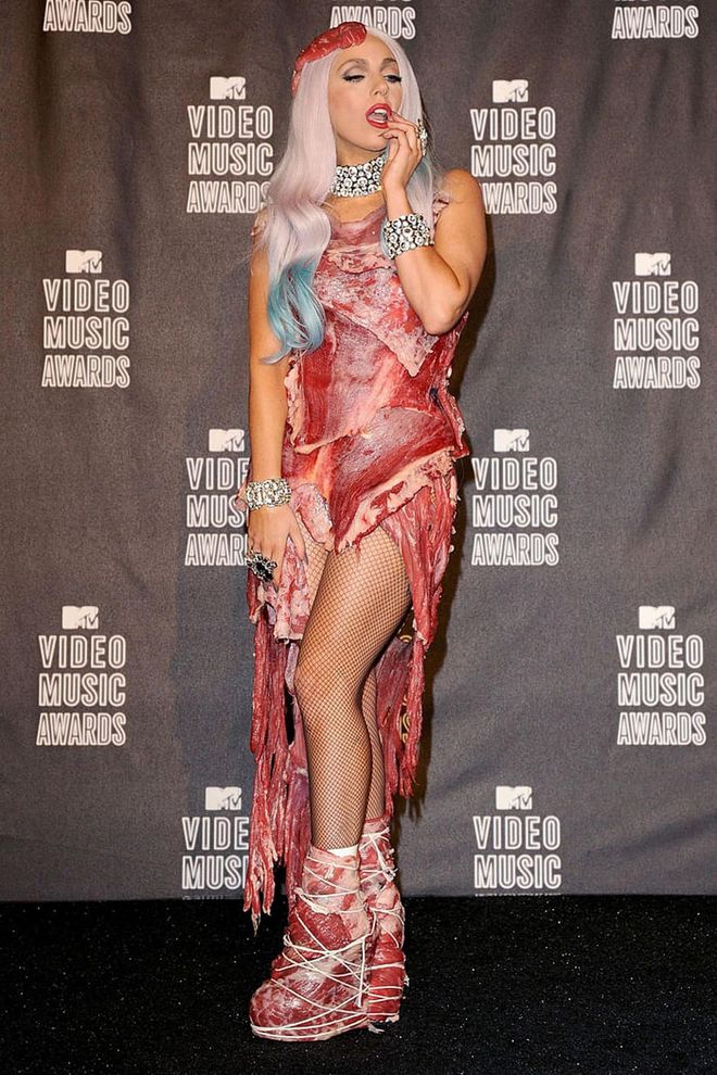 The meat dress, as it's now known, was the third outfit Lady Gaga wore at the VMAs in 2010. It didn't just look like meat, it was made with raw flank steak. The Franc Fernandez design (which also included a pair of meat shoes, a meat hat, and a meat purse as part of the ensemble) was later preserved and shown at the Rock and Roll Hall of Fame. It was apparently a statement against the U.S. military's policy of "Don't ask, don't tell." Gaga said this to Ellen DeGeneres after the show: "As you know, I'm the most judgment-free human being on the Earth. It has many interpretations, but for me this evening it's [saying], 'If we don't stand up for what we believe in, if we don't fight for our rights, pretty soon we're going to have as much rights as the meat on our bones.'"