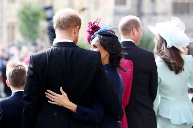 Meghan Markle wraps her around around husband Prince Harry.