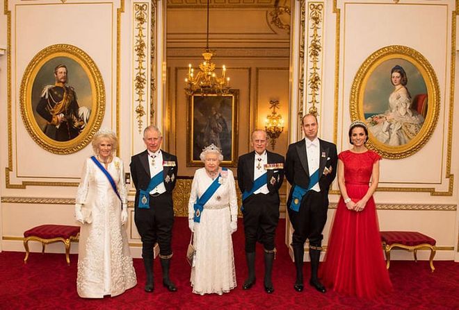 The Duchess of Cornwall, Prince Charles, the Queen, Prince Philip, Prince William, and the Duchess of Cambridge pose for a photo at Buckingham Palace before the annual evening reception for members of the Diplomatic Corps at Buckingham Palace.