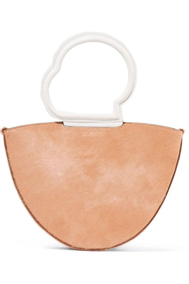 Even though this label just debut recently, it has quickly risen in popularity  thanks to its sleek, architecture inspired designs and amazing price point. This tote just oozes chic