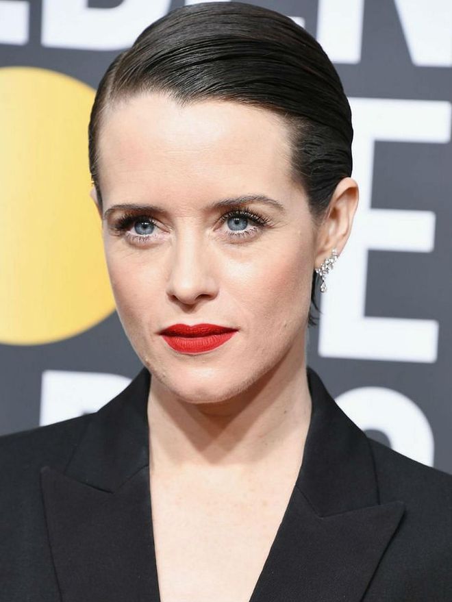With lashings of mascara, matte red lips and a slicked back 'do, Claire Foy has got her power red carpet look down to a T.