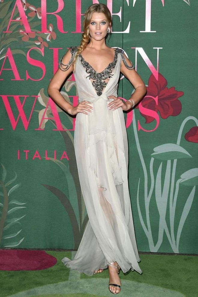 Toni Garrn wore a sheer dress with a beaded neckline.

Photo: Getty Images