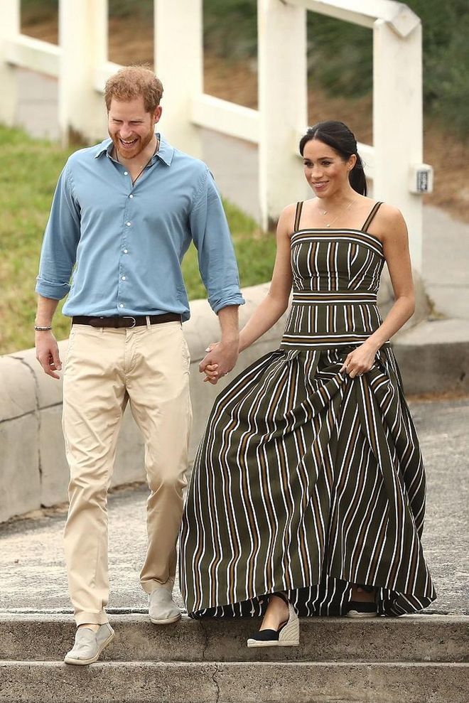 Meghan had a day at the beach during the royal tour and chose the perfect olive and brown striped maxi dress by Martin Grant.  She paired the look with  CASTAÑER wedges (a favourite among the royal family). 