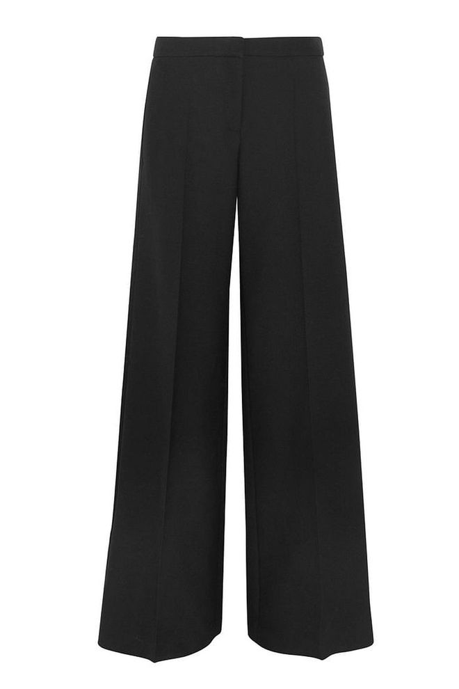 The antidote to bodycon and skinny jeans, this season's new silhouette is voluminous. The wide-leg trouser is key here, and, contrary to popular belief, you don't need to be tall and willowy to wear it. Just make sure that whatever top you're wearing is fitted and steer clear of chunky fabrics. High-waisted styles are the most flattering.
<b>Satin-trimmed wool trousers, £1,075, Alexander McQueen</b>