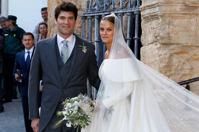 May 2016 Lady Charlotte Wellesley married American-Colombian businessman Alejandro Santo Domingo in Illora, Spain, wearing a custom Emilia Wickstead gown.

