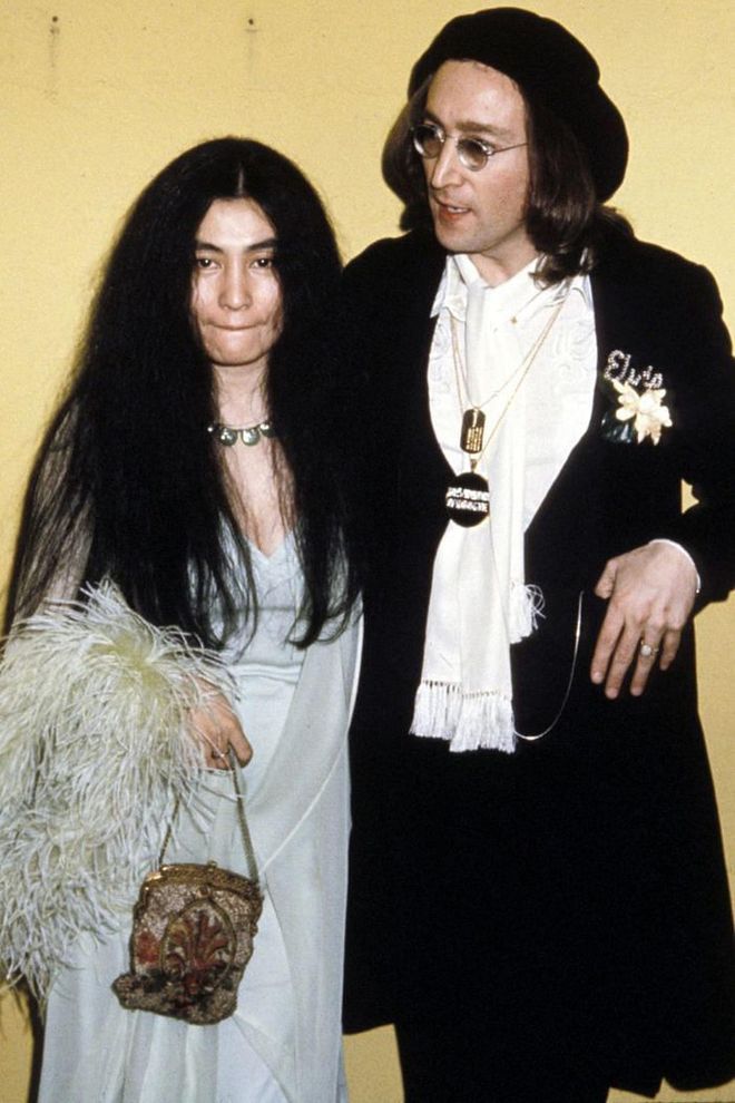 In 1975, Yoko Ono and John Lennon showed up to the Grammys together in looks that could still be worn today. Yoko opted for a feathered shawl, slip dress, and mini bag, while John donned a suit and beanie.