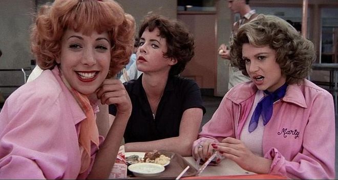 Grease's OG girl gang has everything: matching jackets, serious '50s curls, the opportunity to spontaneously break into song—plus Rizzo's all-black cool girl outfit for your friend who's not into dressing up. Photo: Paramount Pictures