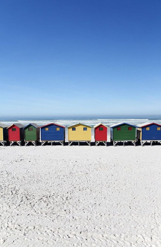 The neighborhood of Bo Kaap in this South African beach destination uses bright hues to distinguish different addresses and is one of the most colorful communities ever. The beach is no exception, as it's lined with primary-colored huts.