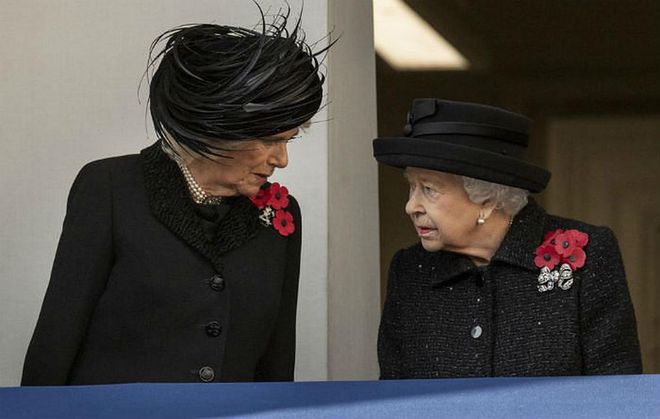 The queen and Duchess Camilla talk on the balcony.

Photo: Getty