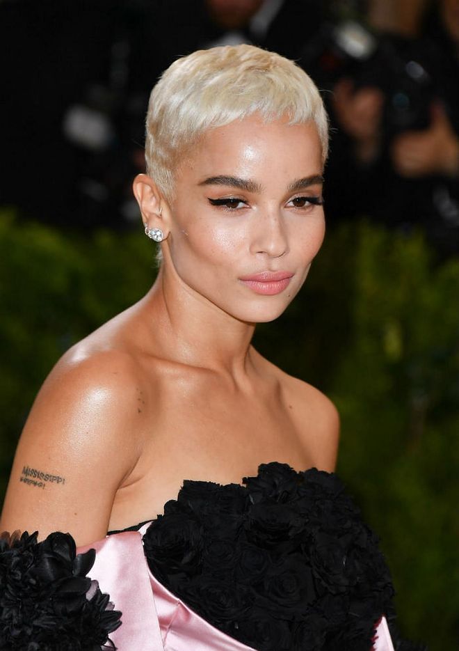 Kravitz hung her signature dreadlocks at home and opted for a sleek bleached pixie cut which showed off her impeccable features (Photo: Getty)