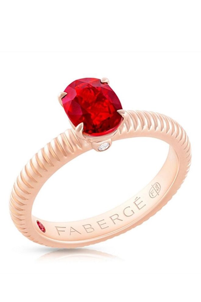 this dainty ring gives its full, undivided attention to the oval Mozambican ruby centre stone, however, concealed within the setting is a matching ruby on the inside of the ring. Faberge Ruby Ring, S$14,340