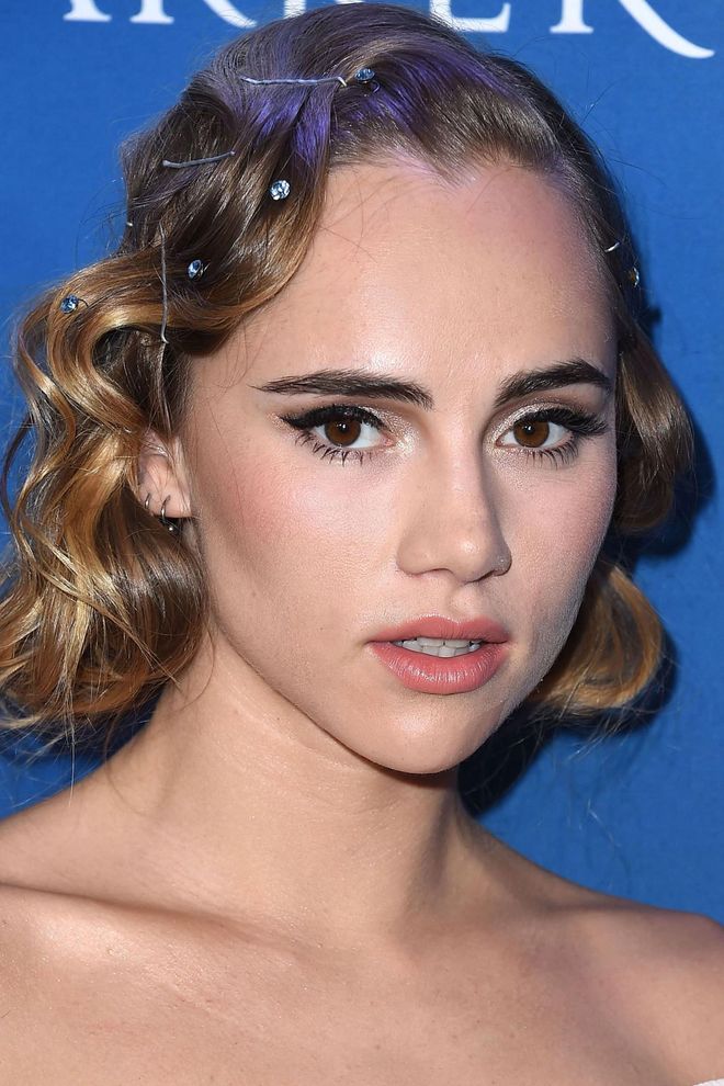 Upgrade your generic bobby pins for jeweled versions and use them to punctuate retro curls. Photo: Getty
