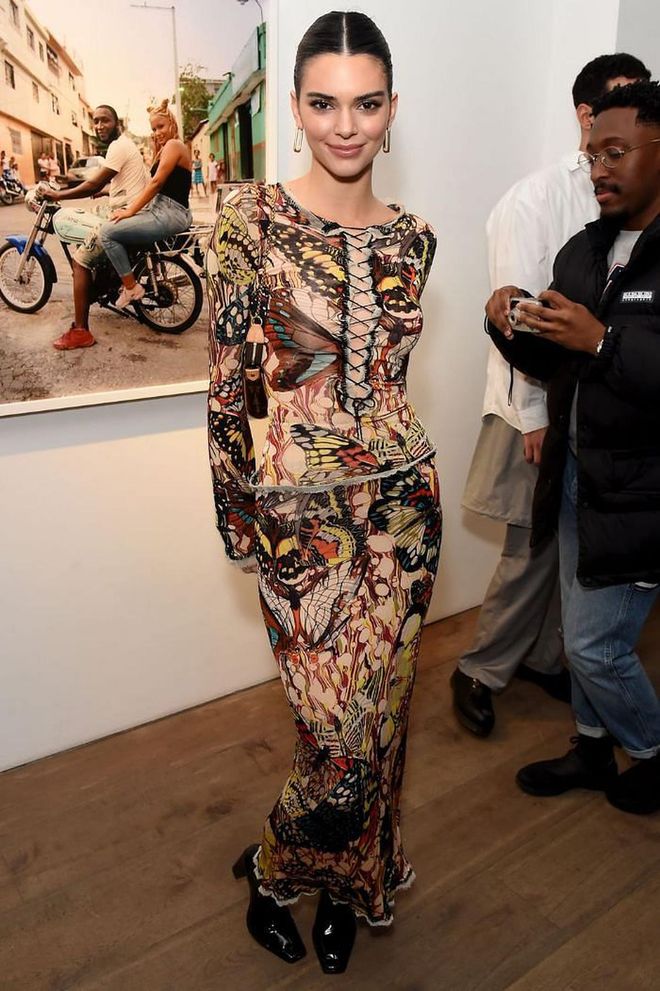Kendall Jenner attended the launch of the photographer's debut solo exhibition wearing a butterfly-print dress and Missoma hoop earrings.

Photo: David M. Benett / Getty