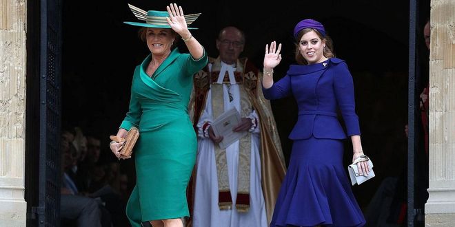 Sarah Ferguson and Maid of Honor Princess Beatrice waving to the crowds as they enter St. George's Chapel.