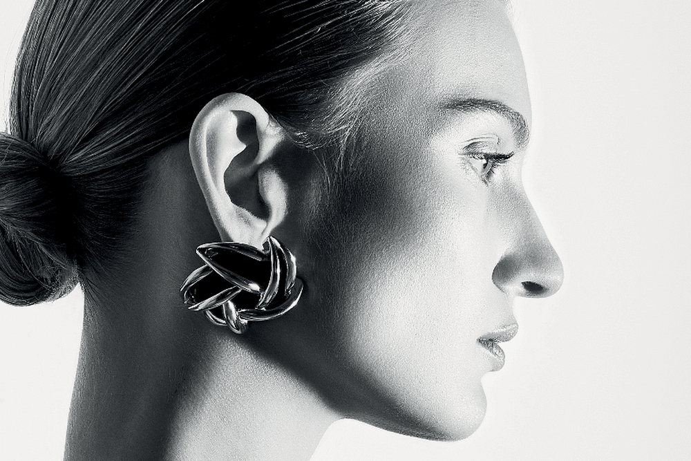 Bodysuit; earrings, Saint Laurent by Anthony Vaccarello. Photo: Gan