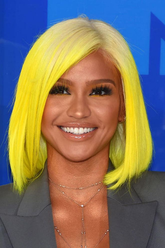 Cassie offsets her sun-kissed glow with a neon yellow, shoulder-length bob. Extra points for her slashes of 'do-matching liner below the waterlines. 