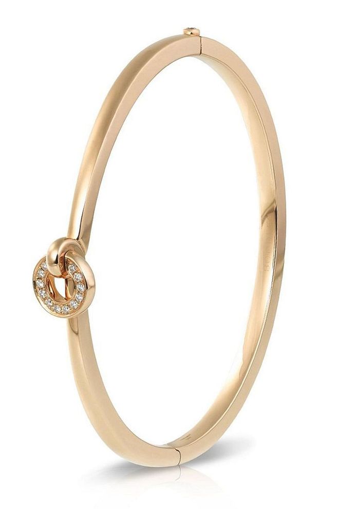 Boodles' rose-gold bangle is contemporary and fun with the inclusion of a flip charm.