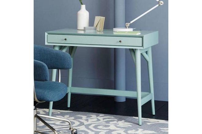 When paired with black and white accessories, robust teal and polished aqua enliven a minimalist office.
Similar to shown: Bora Bora Shore by Sherwin-Williams. 