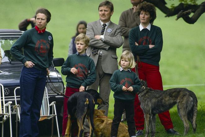 Peter and Zara Phillips play with their pet dogs while at the Windsor Horse Trials. And not to be missed: the matching sweatshirts on Princess Anne and her two kids.
Photo: Getty 