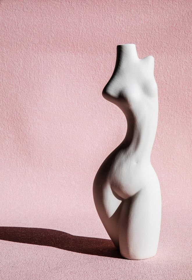 The female body pottery against pink background (generic product in china)