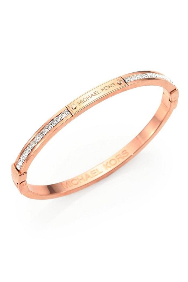 Stack this simple rose gold and cubic zirconia bangle along with some of your more playful bracelets. 