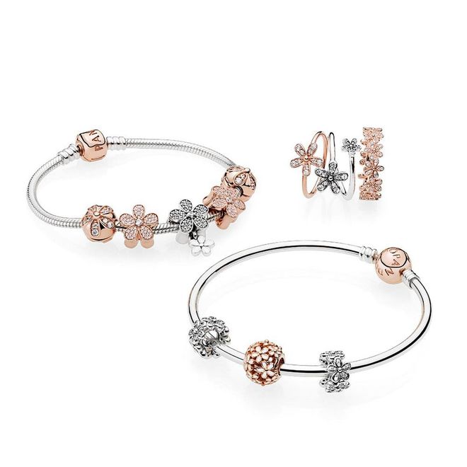 (From top left) Moments Silver Bracelet with PANDORA Rose Clasp, $159; PANDORA Rose Daisy clip, $99; Dazzling Daisy Pendant charm, $149; Dazzling Daisy ring, $99; Dazzling Daisies ring, $99; Dazzling Daisy Band ring; Moments Sterling Silver bangle with PANDORA Rose clasp, $159; Dazzling Daisies spacer, $69; Openwork Daisy PANDORA Rose charm, $99