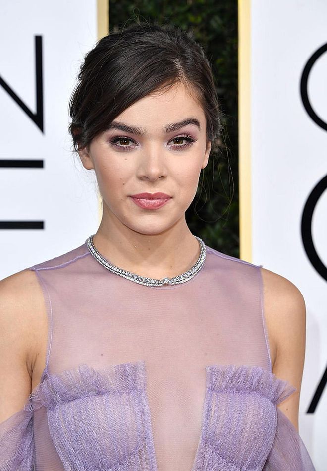 Dressed in a dreamy lilac dress, the 20-year-old starlet completed her look with purple eye shadow and pink lipstick.