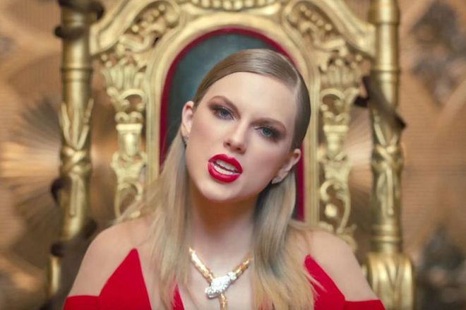 Taylor wore what all snake queens wear when they're surrounded by family: raspberry-red lipstick and a deeply sleek side part.