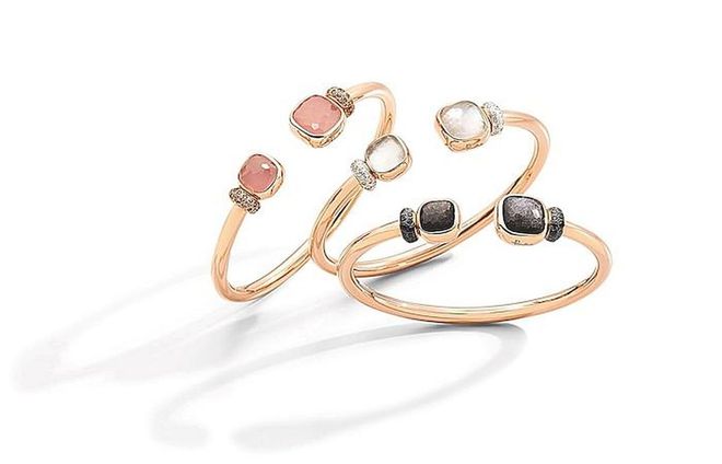 From left: Nudo bangles in rose gold with rose quartz, rose chalcedony and brown diamonds; rose gold with white topaz, mother-of-pearl and diamonds; rose gold with obsidian and black diamonds. (Photo: Pomellato)