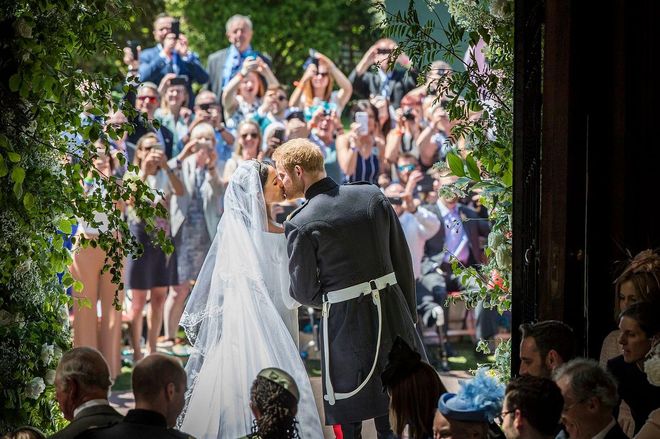 Prince Harry kisses his wife, the Duchess of Sussex