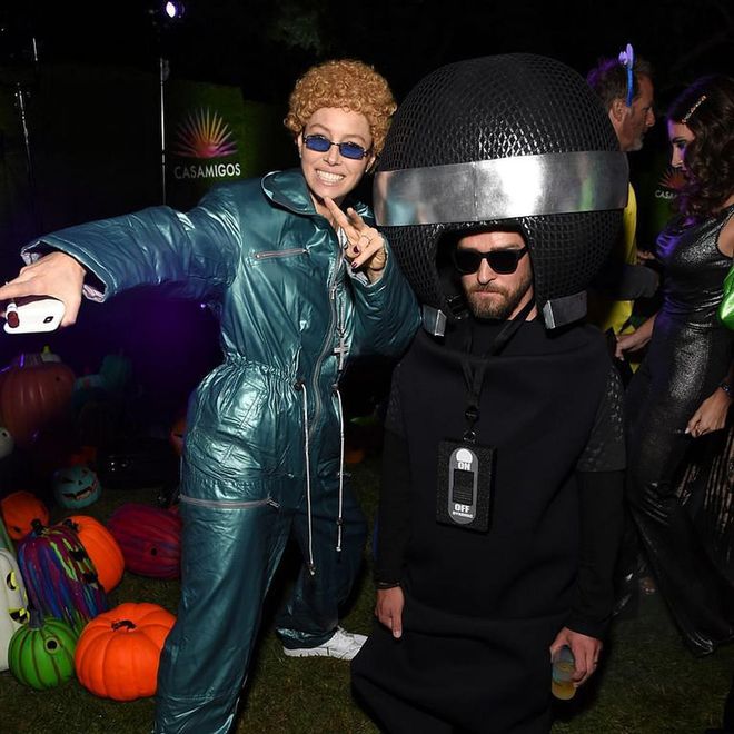 Biel dresses up as Timberlake during his *NSYNC era, while her husband plays a giant microphone. Brutal.
