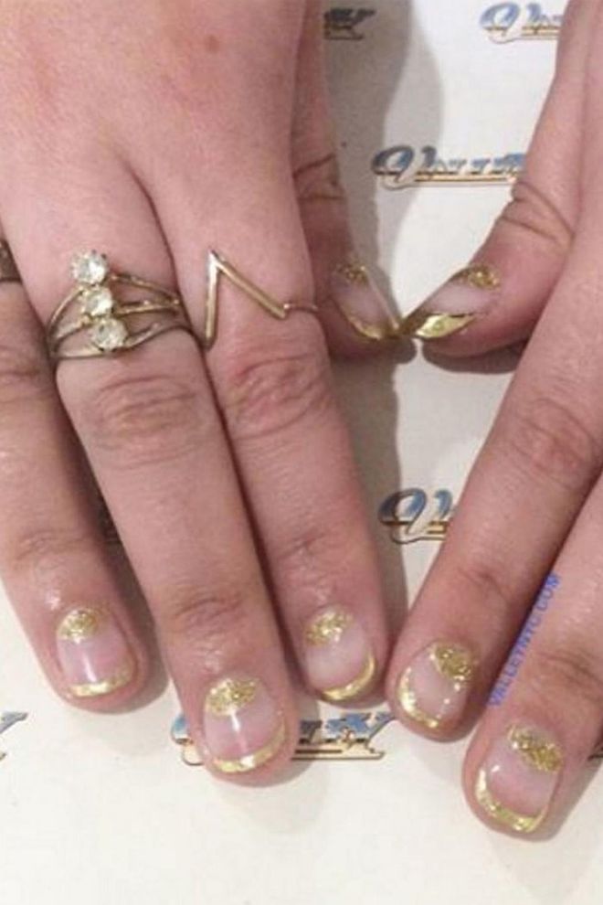Put a festive spin on the runway's favourite double moon design with a gold-on-gold polish palette.
@valleynyc