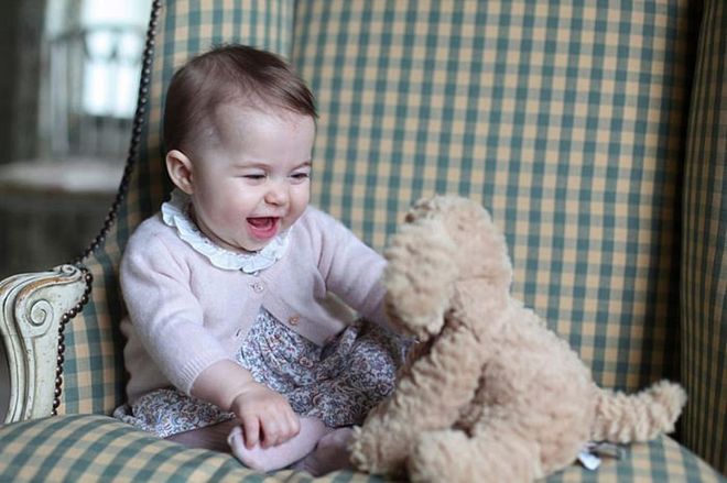 Princess Charlotte plays with a stuffed toy at Anmer Hall in November 2015. The adorable candid was taken by Kate Middleton in Sandringham, England.