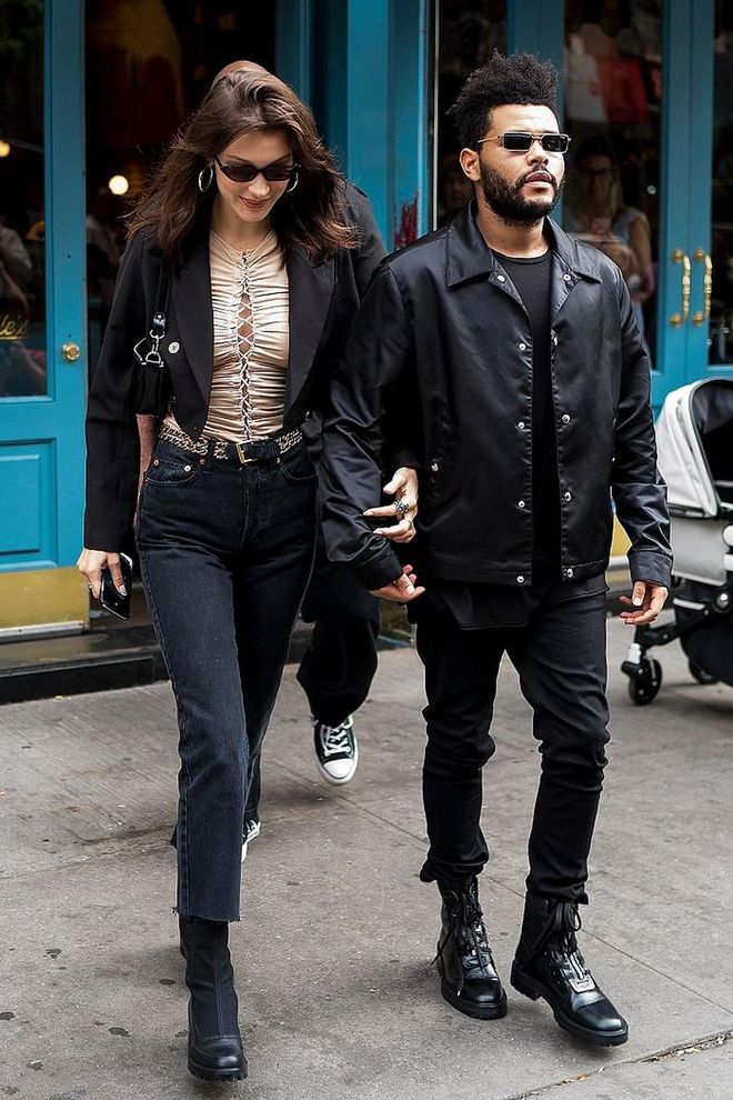 Bella went on a brunch date with The Weeknd in a laced up top by Unravel and black denim by Re/Done. She dresses up the look with a black Danielle Guizio blazer and sunglasses. 
