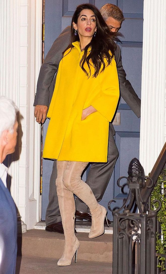Avoid making your boots the focal point of your outfit by opting for a neutral-coloured pair and teaming with a bright statement coat, as demonstrated by Amal Clooney.